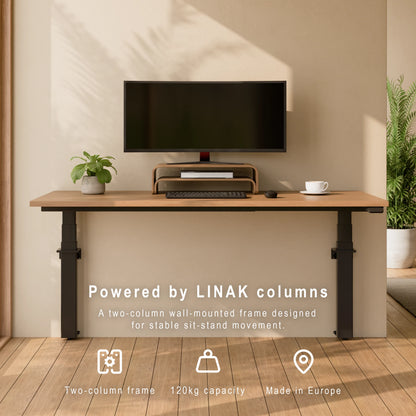 Front view of a wall-mounted height adjustable desk powered by LINAK columns with oak desktop and monitor