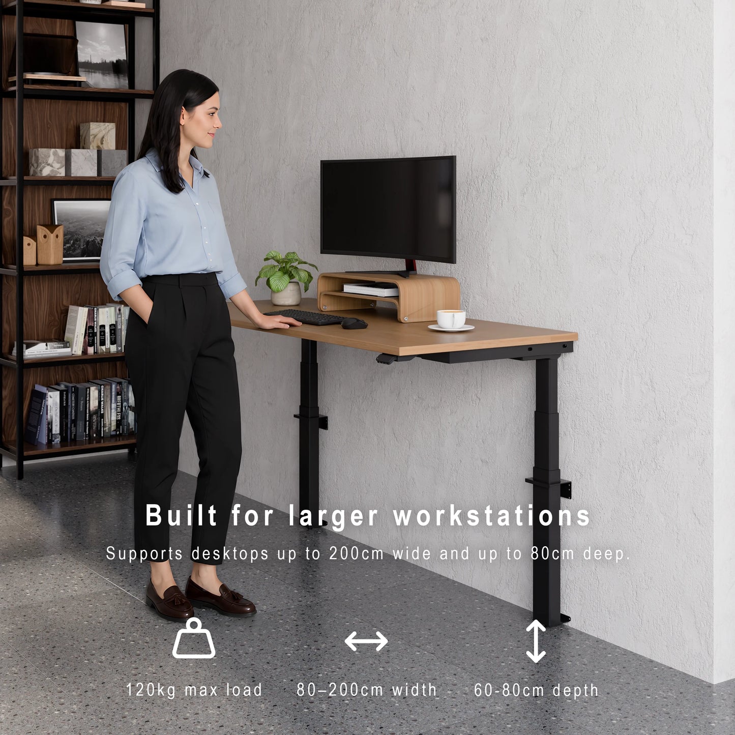 Large wall-mounted height adjustable desk supporting wide desktops, deep workstations and 120kg maximum load. Person standing at a adjustable desk with text highlighting its features.