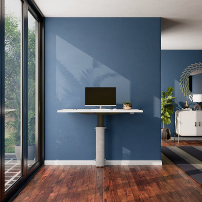 ConSet 501-19 modular wall mounted standing desk with white desktop and monitor in a home office