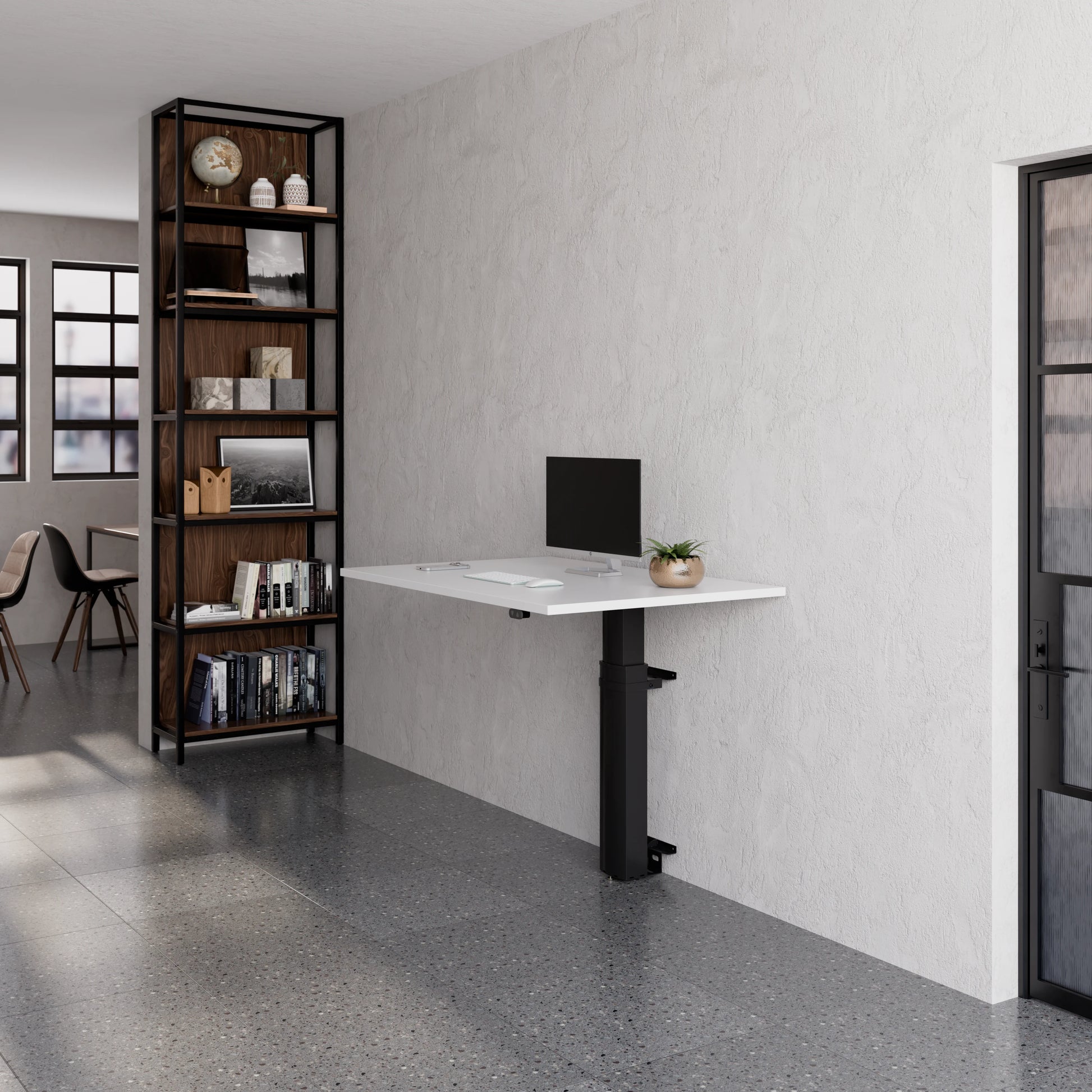 ConSet 501-19 modular wall mounted desk set up with monitor in a modern office space