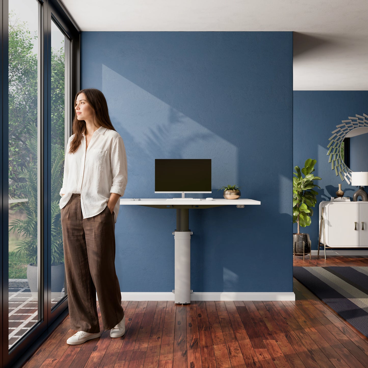 Person standing beside the ConSet 501-19 modular wall mounted desk in a home office