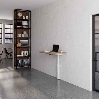 Linak Wall Solo adjustable desk set up with laptop in a modern office space